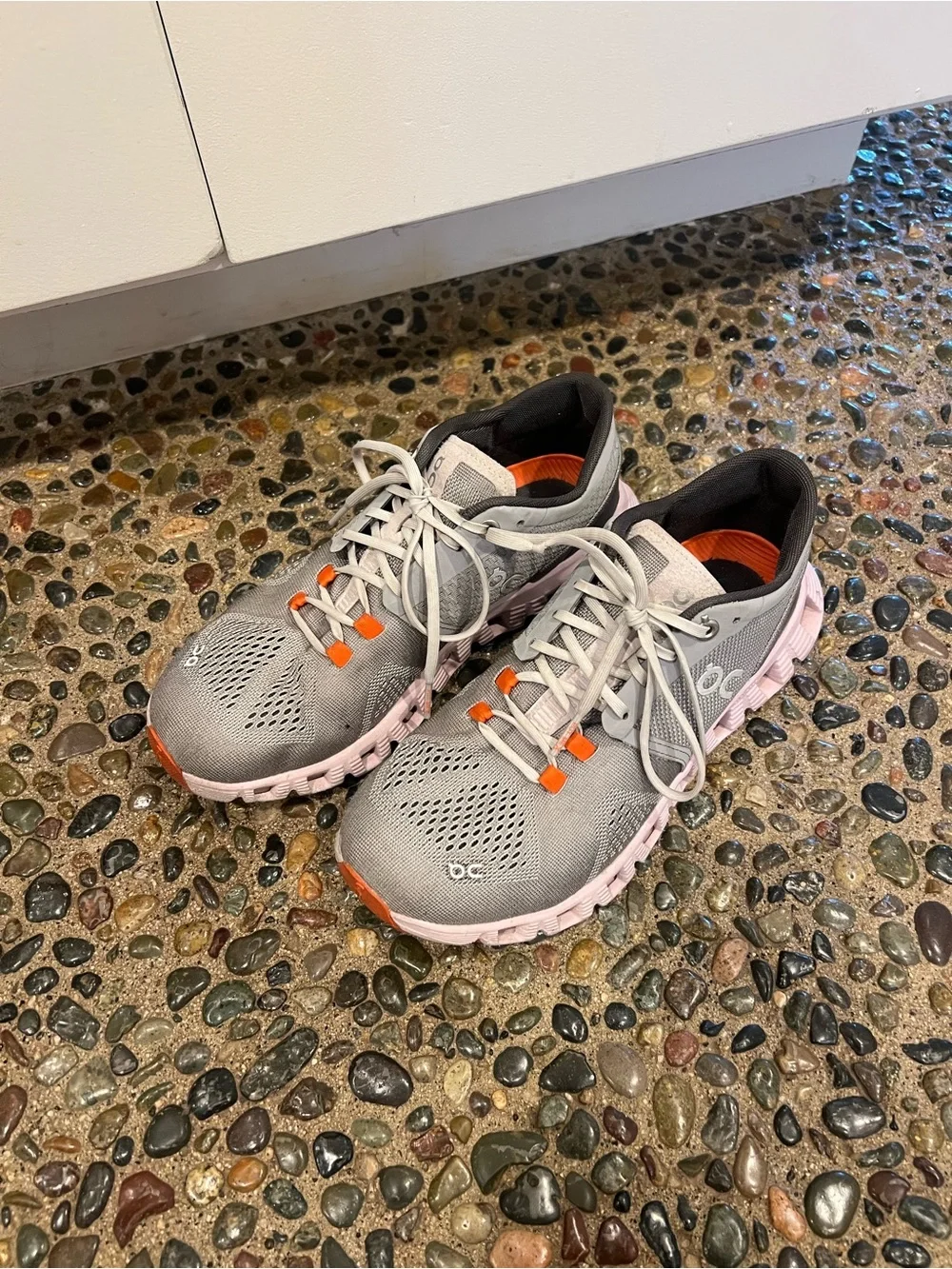 On Running womens Gray Athletic Shoes with Pink Soles and Orange Accents